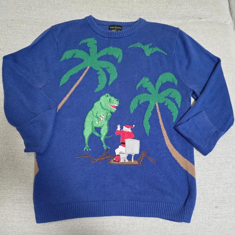 Alex Stevens blue Christmas sweater with comedic Santa Claus and dinosaur design